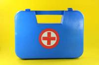 helth and safe concepts first aid box in yellow background